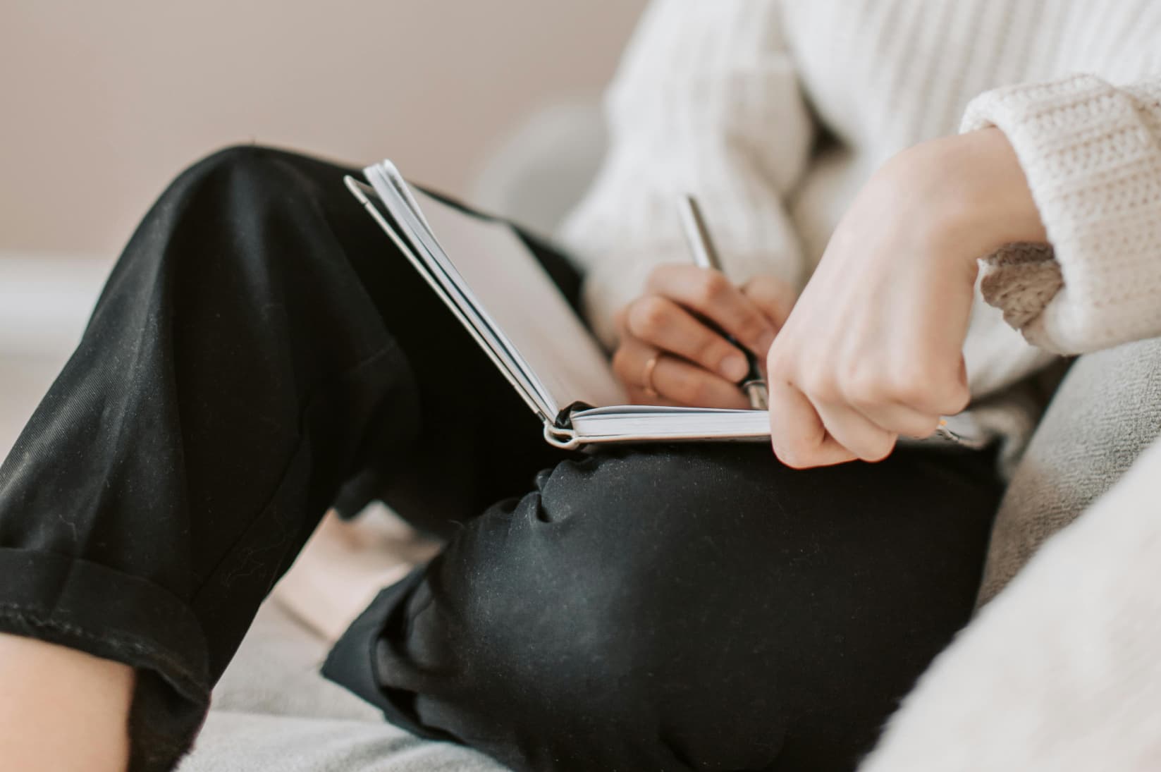 Person journaling by candlelight